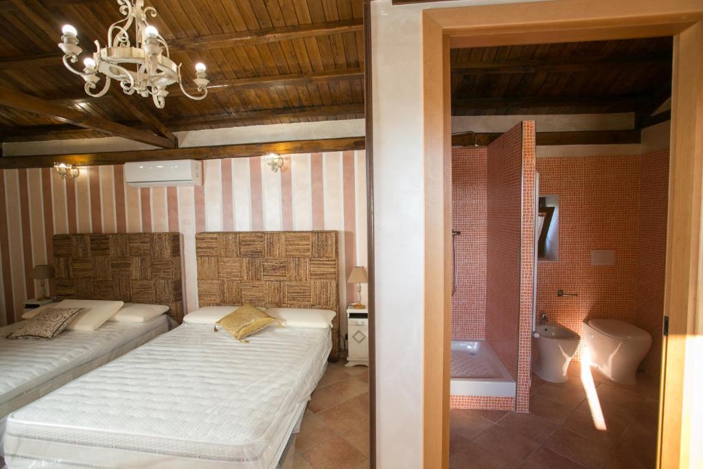 Posteľ alebo postele v izbe v ubytovaní B&B oasi di mamma clara