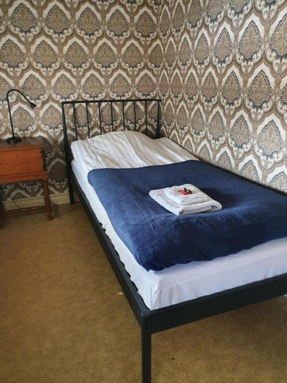 Säng eller sängar i ett rum på Gramersgården