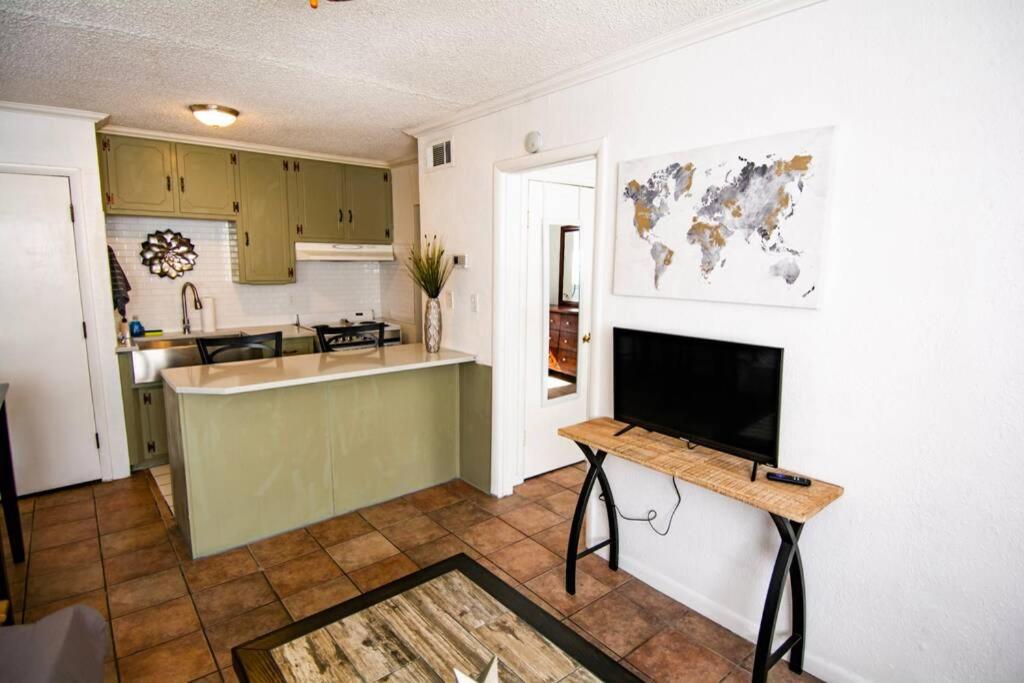a kitchen and living room with a table in it at Central Automobile Alley Modern 1BDR - WIFI in Oklahoma City