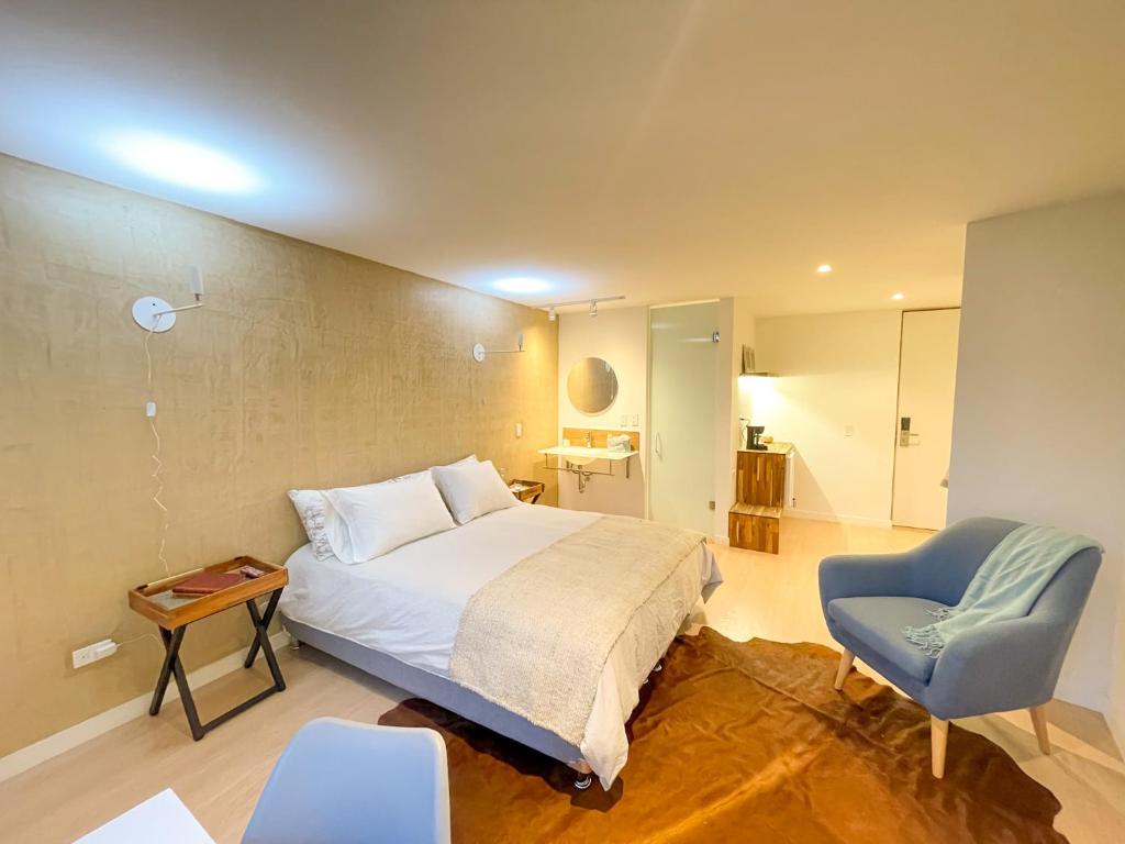 Postel nebo postele na pokoji v ubytování Lucitania Hotel Boutique