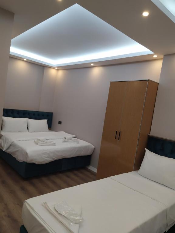 A bed or beds in a room at BoNaMi Hotel