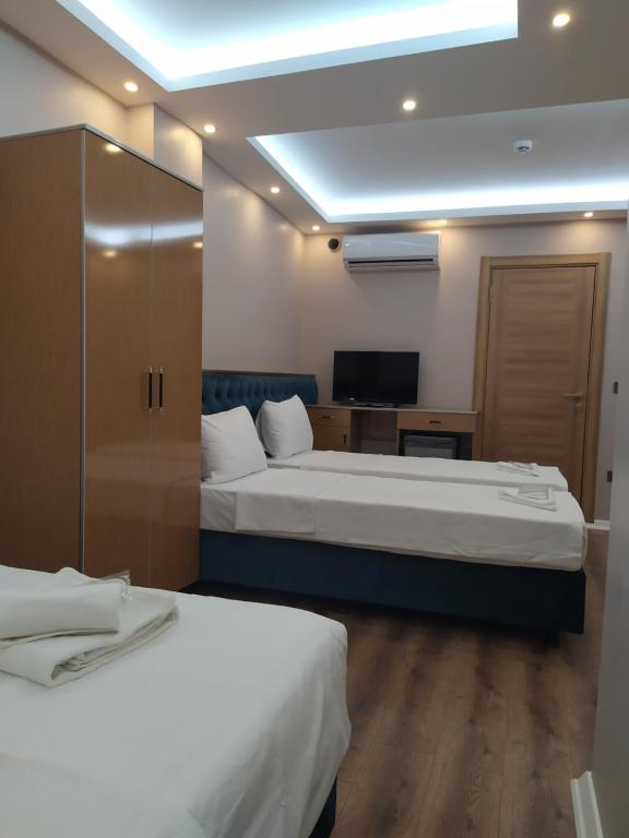 A bed or beds in a room at BoNaMi Hotel