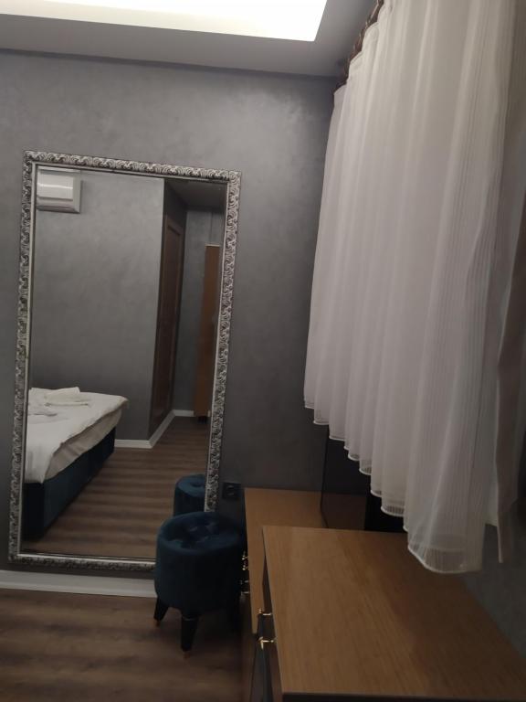 A bed or beds in a room at BoNaMi Hotel