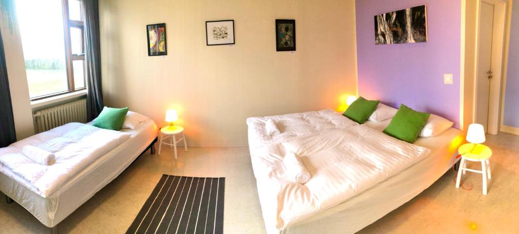 Rúm í herbergi á Paradise Cave Hostel & Guesthouse