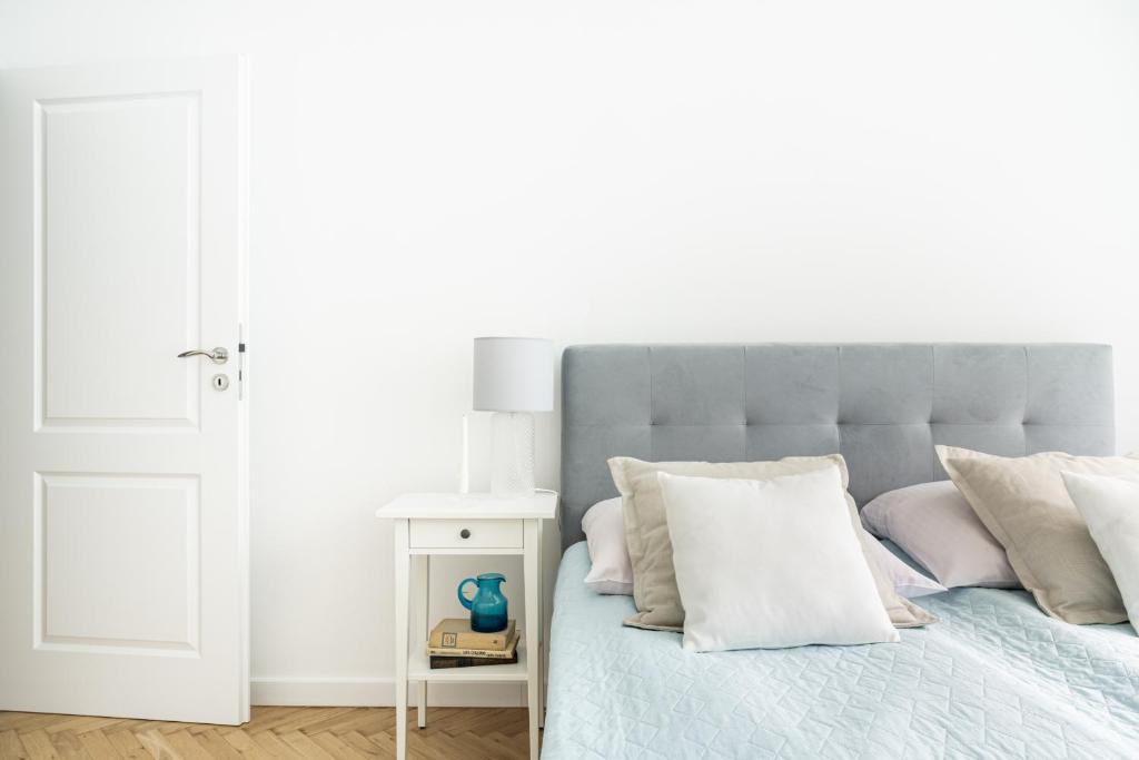 Posteľ alebo postele v izbe v ubytovaní Prestige Apartamenty Za Cieszynianką 1D