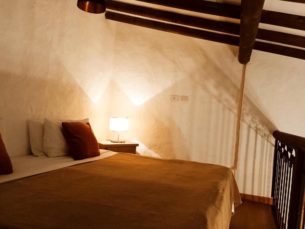 Postel nebo postele na pokoji v ubytování HOTEL LA POSADA DEL ZAGUÁN