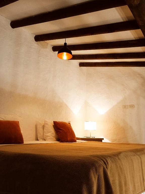 Postel nebo postele na pokoji v ubytování HOTEL LA POSADA DEL ZAGUÁN