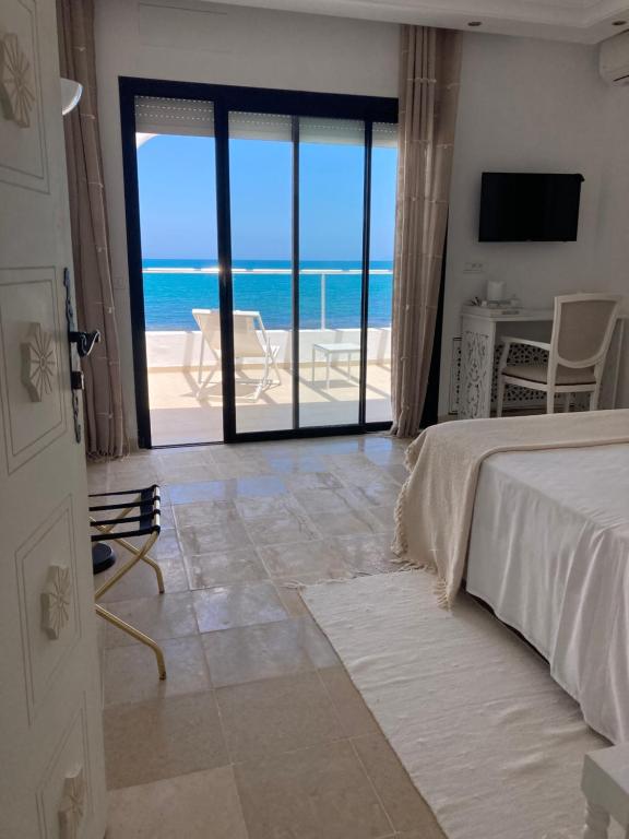 Voodi või voodid majutusasutuse Dar Corniche La Marsa (Adults Only) toas