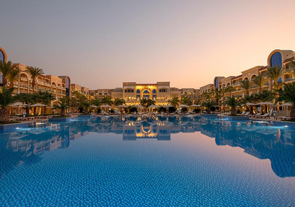 
a large swimming pool in a large city at Premier Le Reve Hotel & Spa Sahl Hasheesh - Adults Only 16 Years Plus in Hurghada
