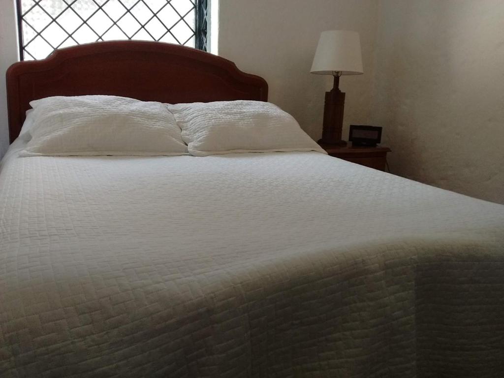 Postel nebo postele na pokoji v ubytování Casa Turística Camitas Inn