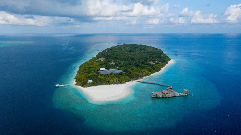 an island in the middle of the ocean at Soneva Fushi in Baa Atoll