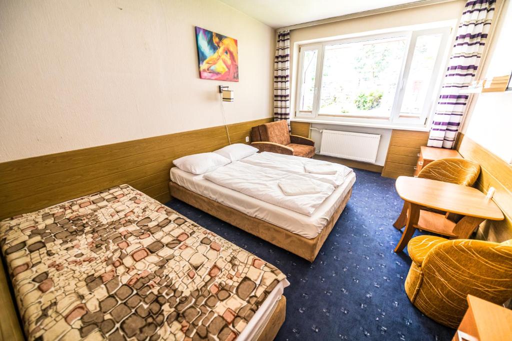 Posteľ alebo postele v izbe v ubytovaní Willa Świerkowa
