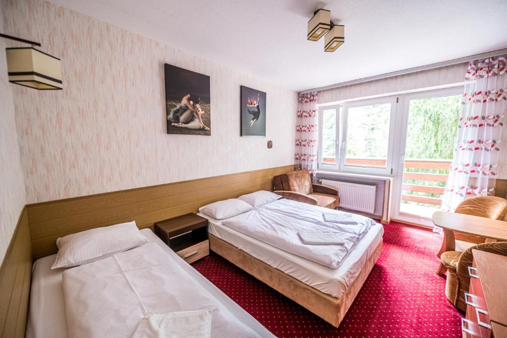 Posteľ alebo postele v izbe v ubytovaní Willa Świerkowa