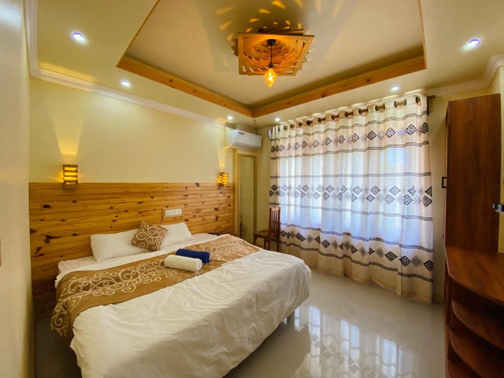 Postel nebo postele na pokoji v ubytování Mariana Maldives