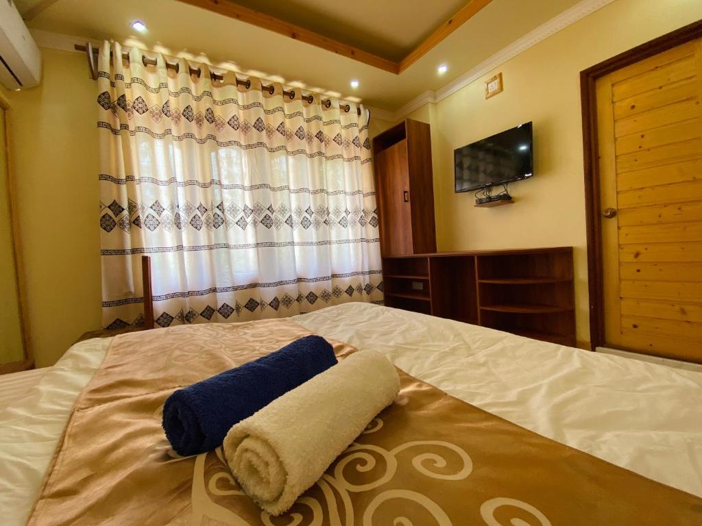Postel nebo postele na pokoji v ubytování Mariana Maldives