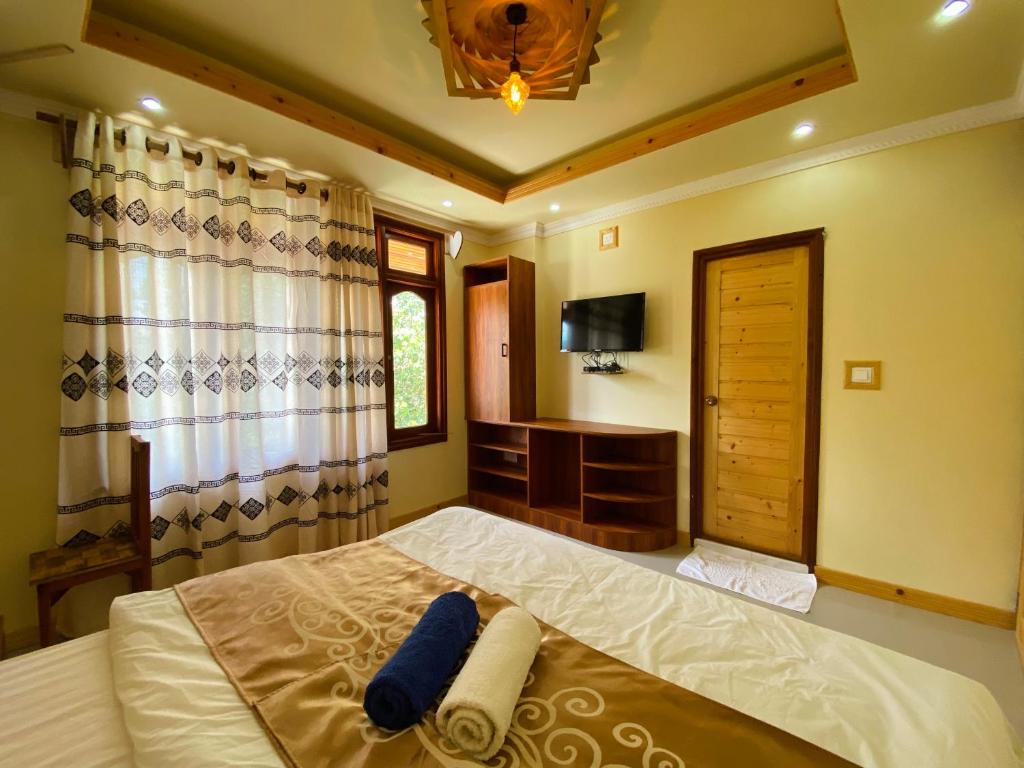 Postel nebo postele na pokoji v ubytování Mariana Maldives