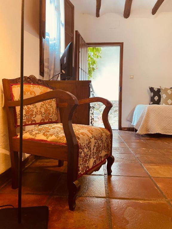 A bed or beds in a room at Casa Rural Catifalarga Alpujarra