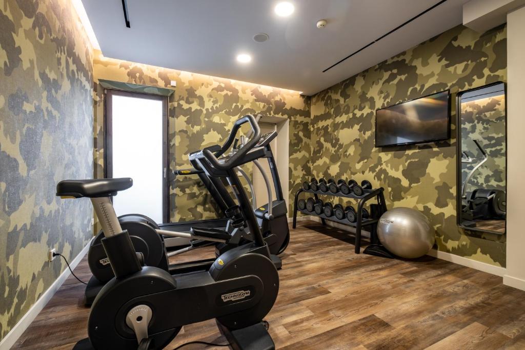a fitness room with a treadmill and a gym at Sant Jaume Design Hotel in Palma de Mallorca