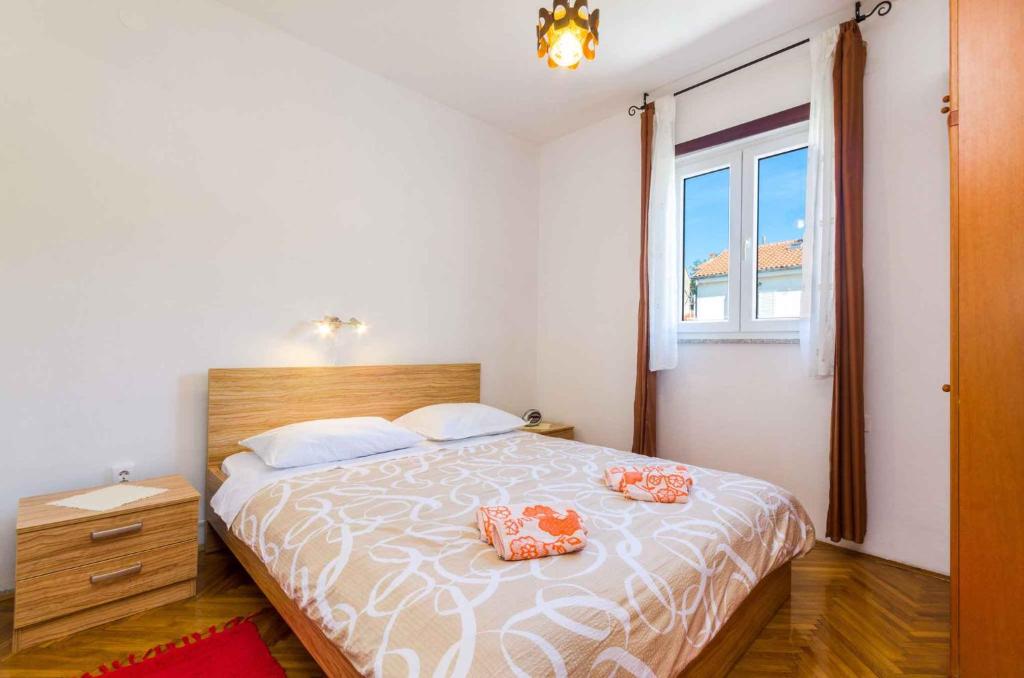 Postel nebo postele na pokoji v ubytování Apartments in Novi Vinodolski 15234
