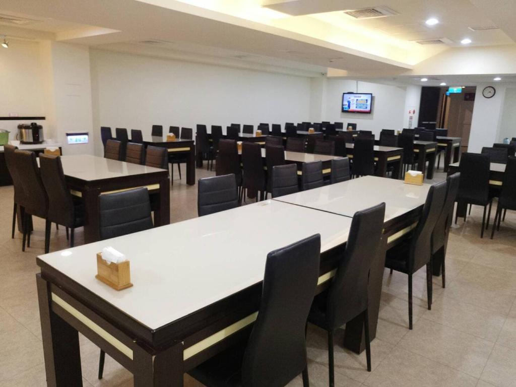 TV a/nebo společenská místnost v ubytování Kaishen Hotel