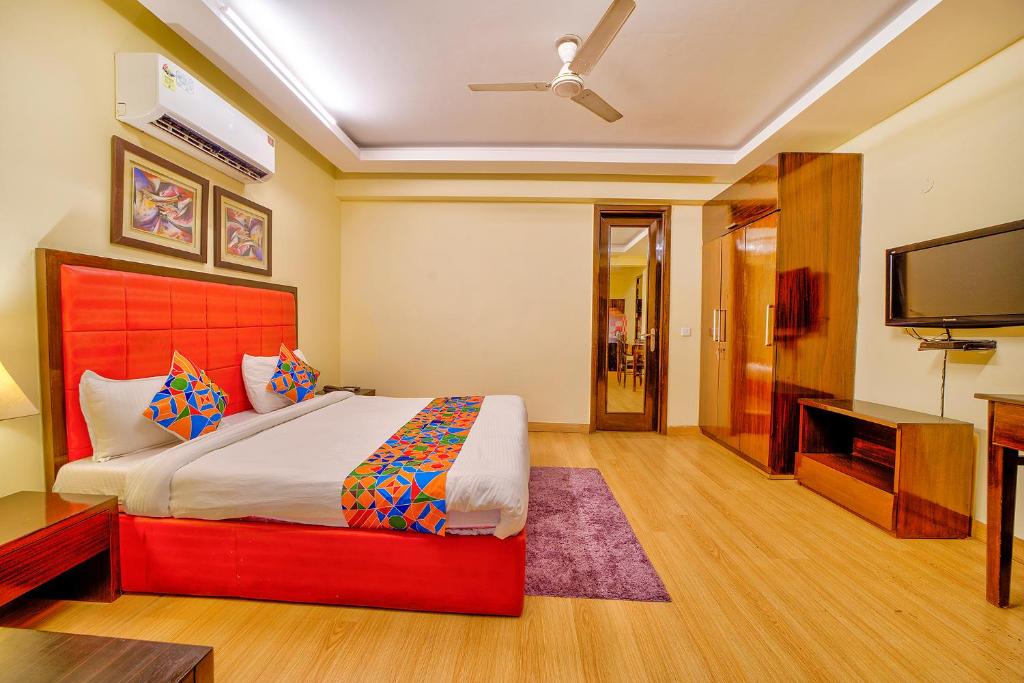 Postel nebo postele na pokoji v ubytování FabHotel Rivlet
