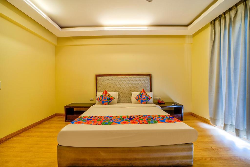 Postel nebo postele na pokoji v ubytování FabHotel Rivlet