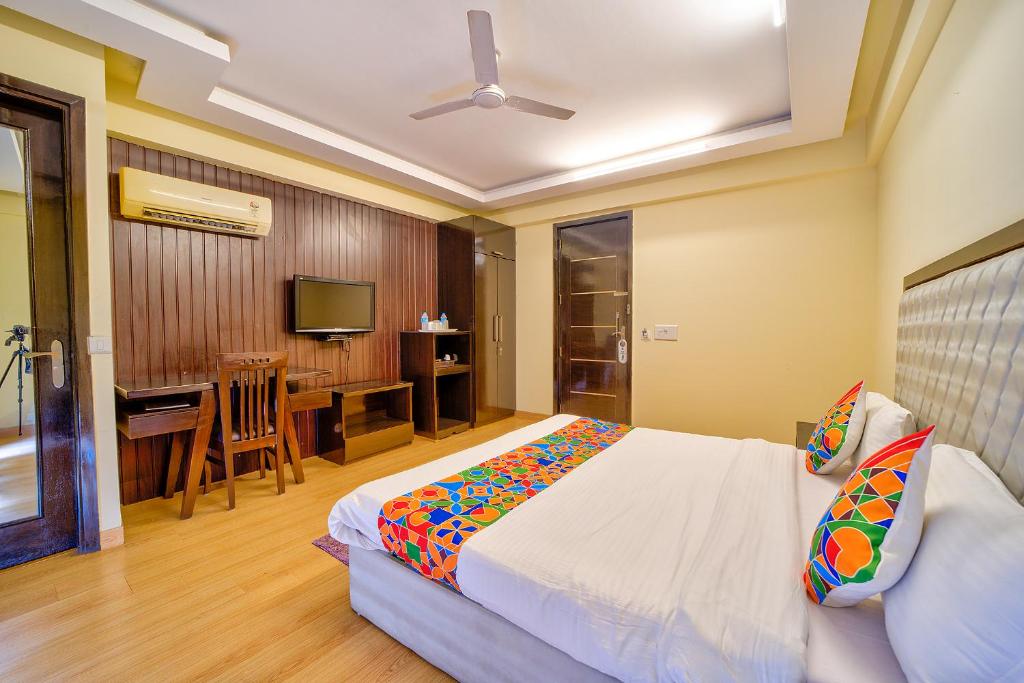 Postel nebo postele na pokoji v ubytování FabHotel Rivlet