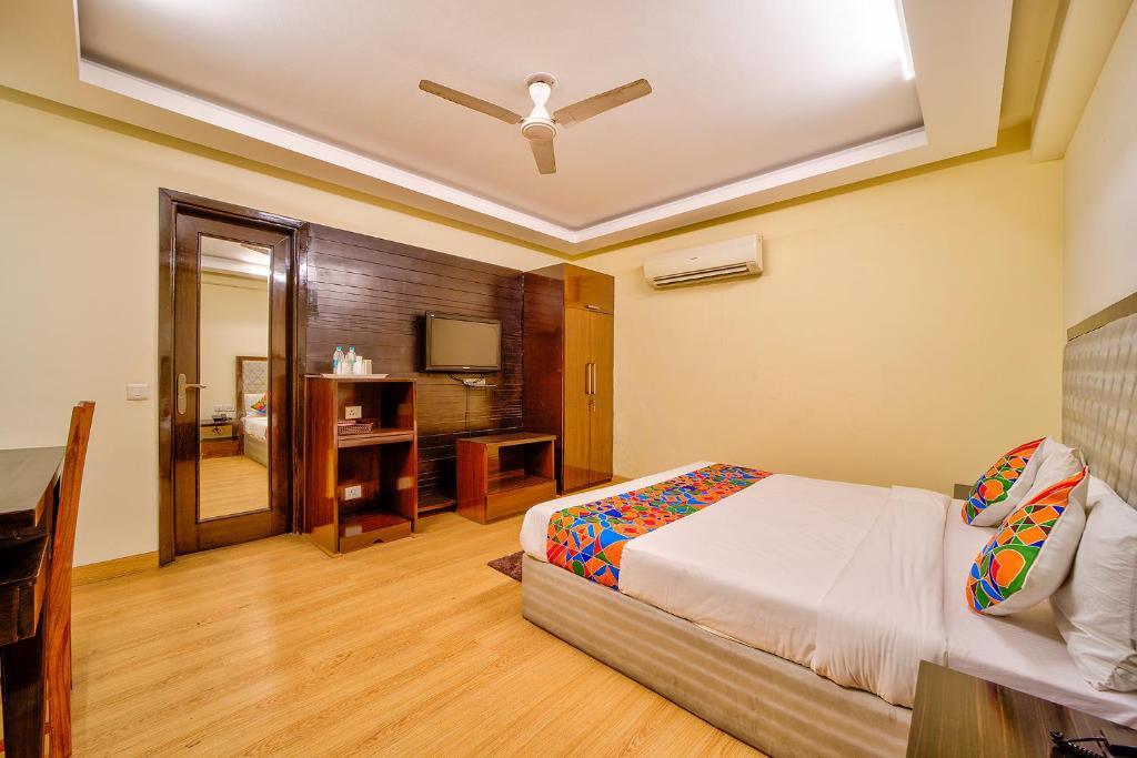 Postel nebo postele na pokoji v ubytování FabHotel Rivlet