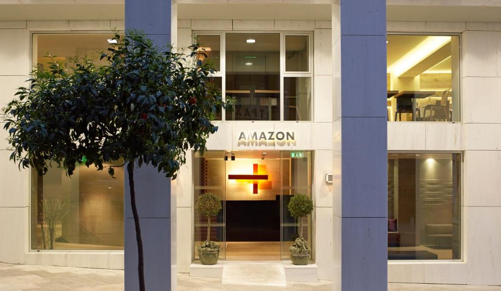 a building with a cross on the front of it at Amazon Hotel in Athens