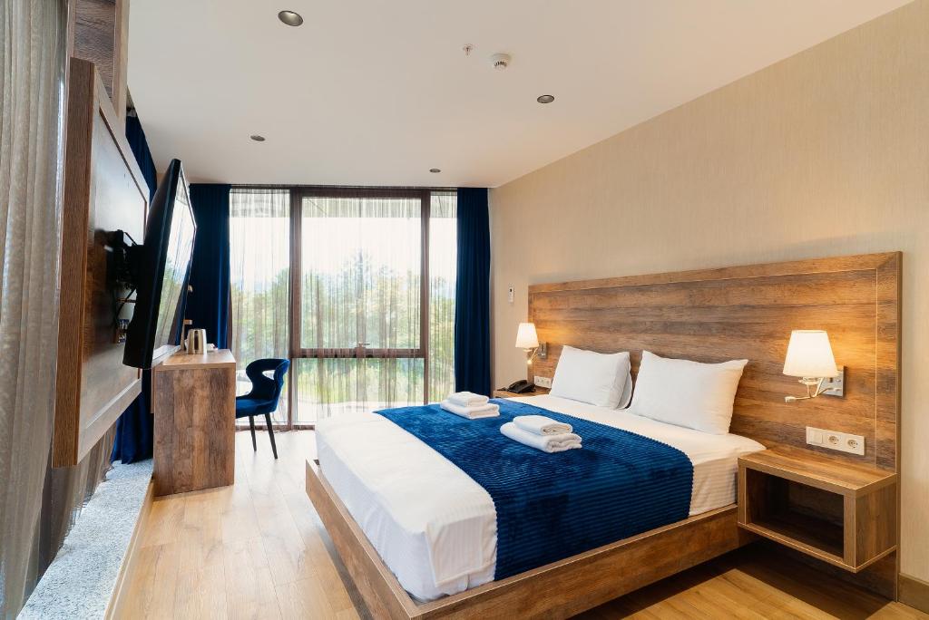 Postel nebo postele na pokoji v ubytování Cozy Loft Hotel