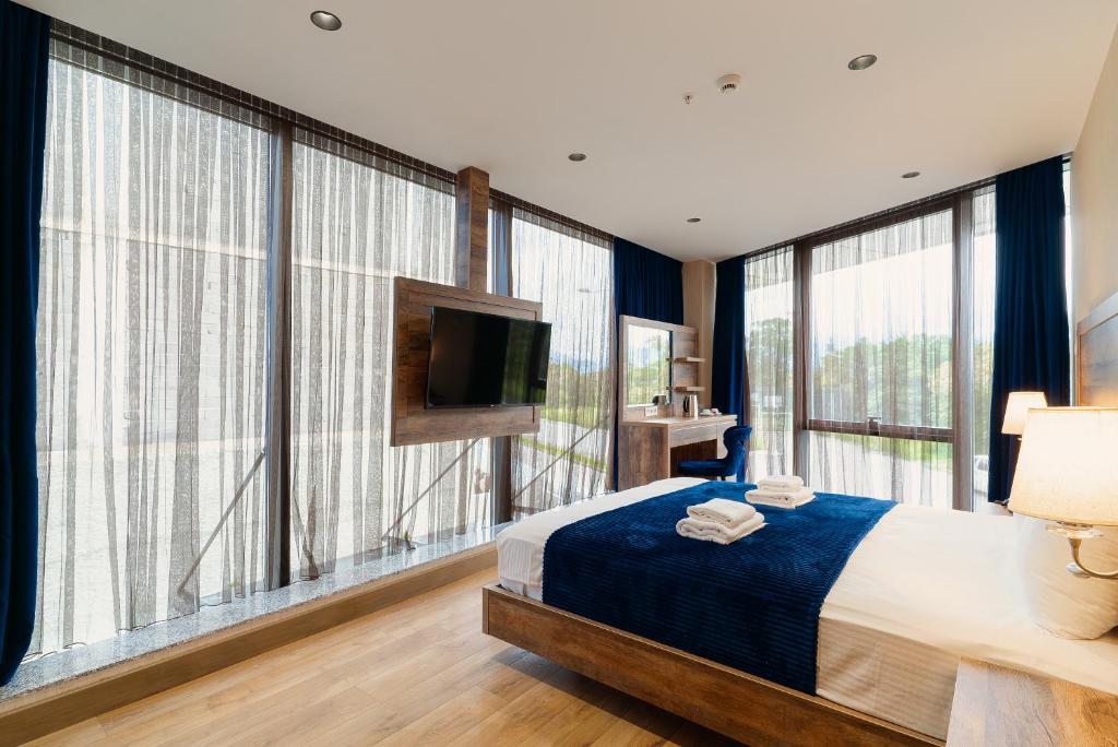 Postel nebo postele na pokoji v ubytování Cozy Loft Hotel