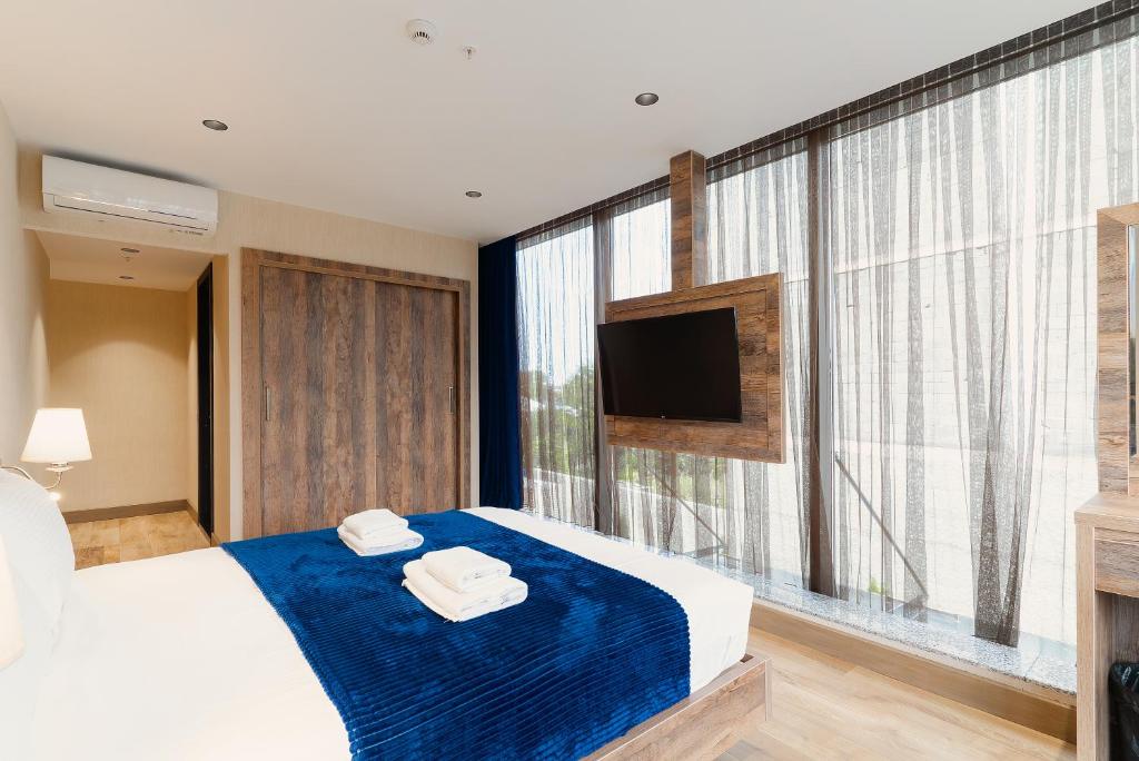 Postel nebo postele na pokoji v ubytování Cozy Loft Hotel