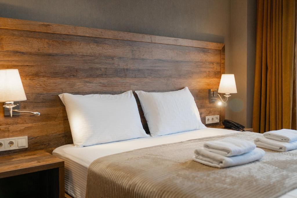 Postel nebo postele na pokoji v ubytování Cozy Loft Hotel