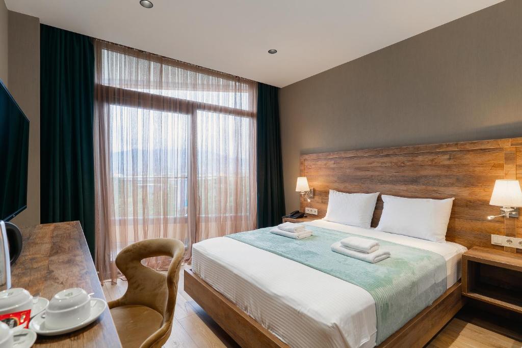 Postel nebo postele na pokoji v ubytování Cozy Loft Hotel