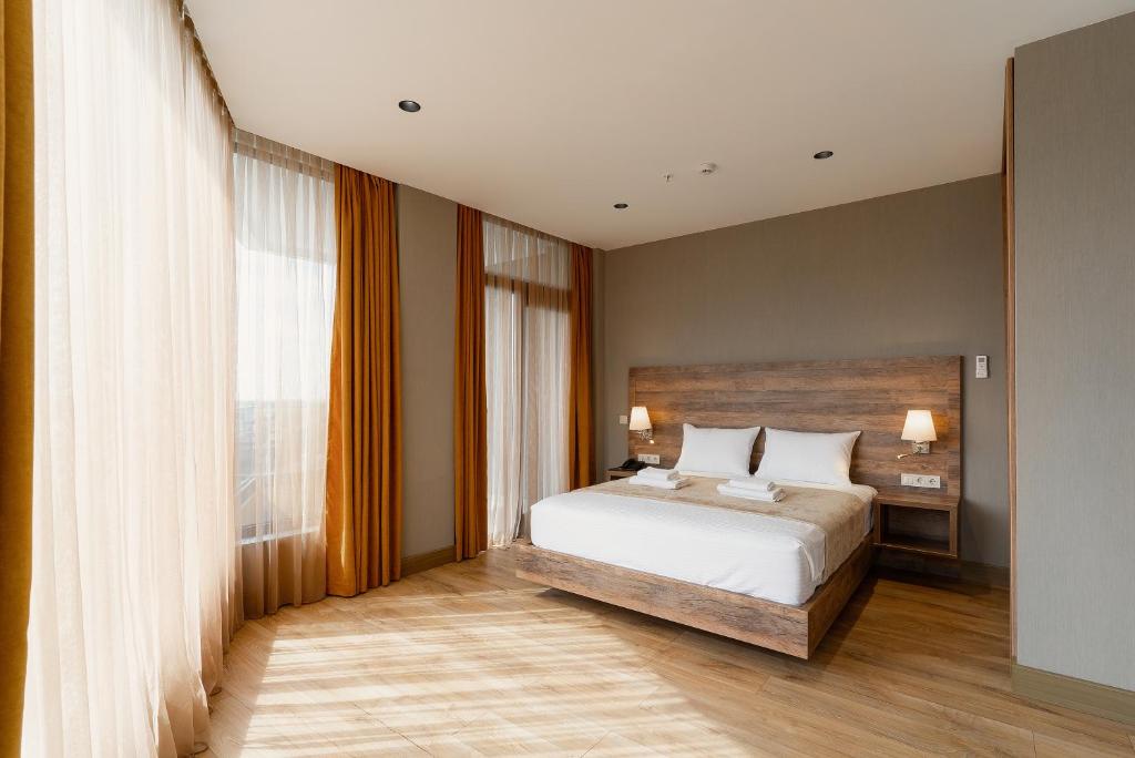 Postel nebo postele na pokoji v ubytování Cozy Loft Hotel