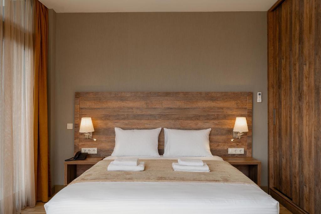 Postel nebo postele na pokoji v ubytování Cozy Loft Hotel