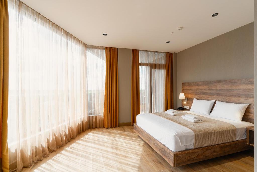 Postel nebo postele na pokoji v ubytování Cozy Loft Hotel