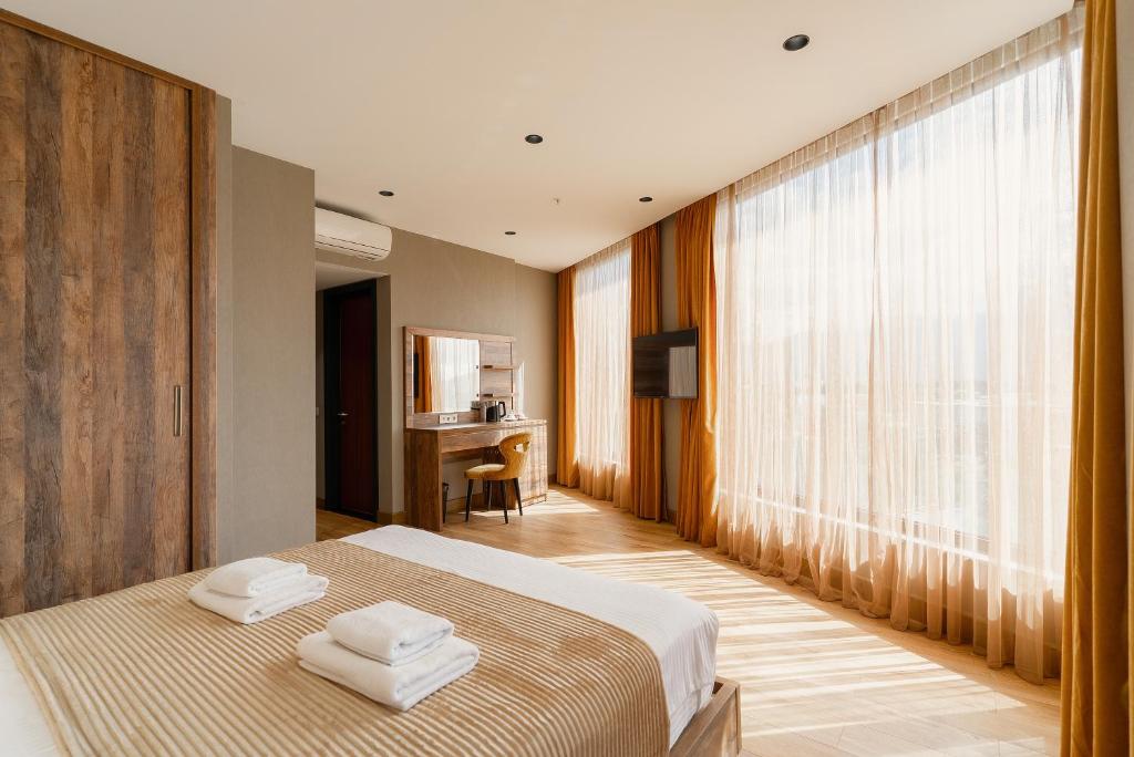 Postel nebo postele na pokoji v ubytování Cozy Loft Hotel