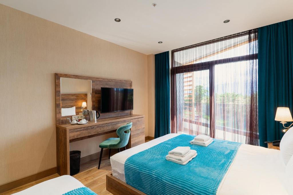 Postel nebo postele na pokoji v ubytování Cozy Loft Hotel