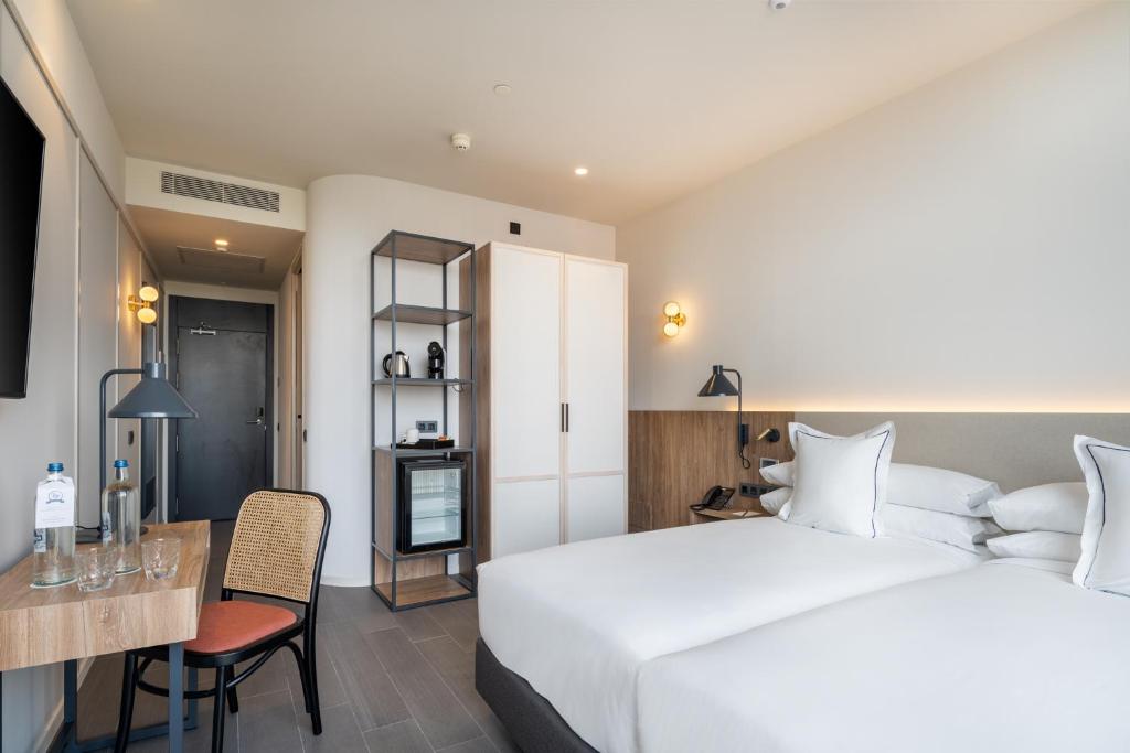 Postel nebo postele na pokoji v ubytování Hotel LIVVO Lumm