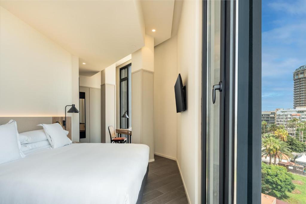 Postel nebo postele na pokoji v ubytování Hotel LIVVO Lumm