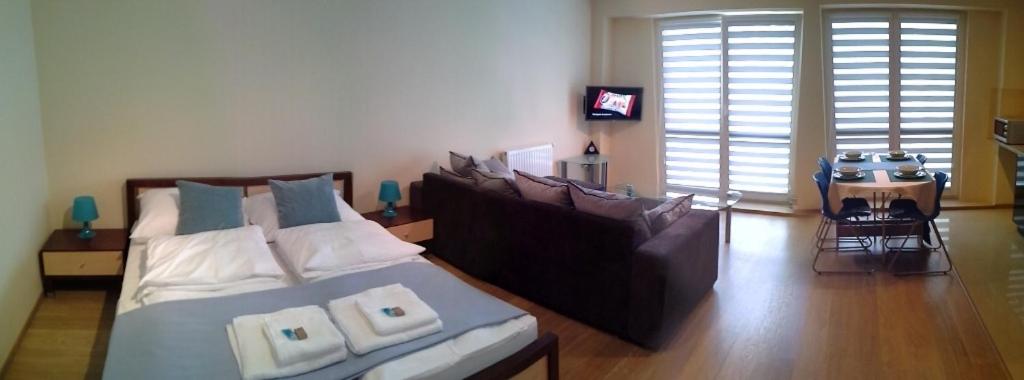 Posteľ alebo postele v izbe v ubytovaní Apartament Niezapominajka