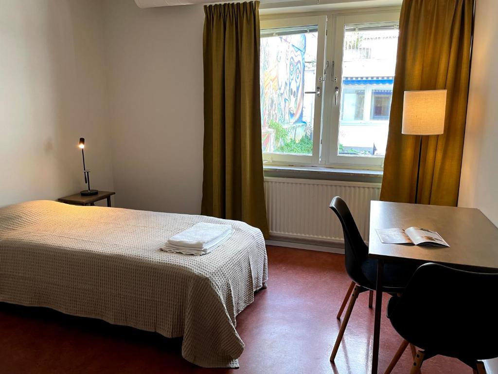 Postel nebo postele na pokoji v ubytování HOTEL N Hostel Malmö City
