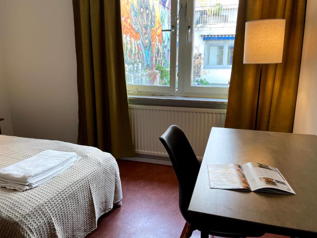 Postel nebo postele na pokoji v ubytování HOTEL N Hostel Malmö City