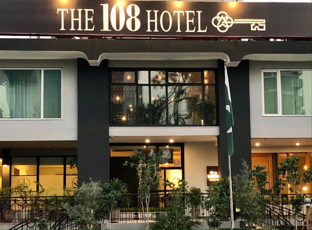 a hotel with a sign that reads the loc hotel at The 108 Hotel in Islamabad