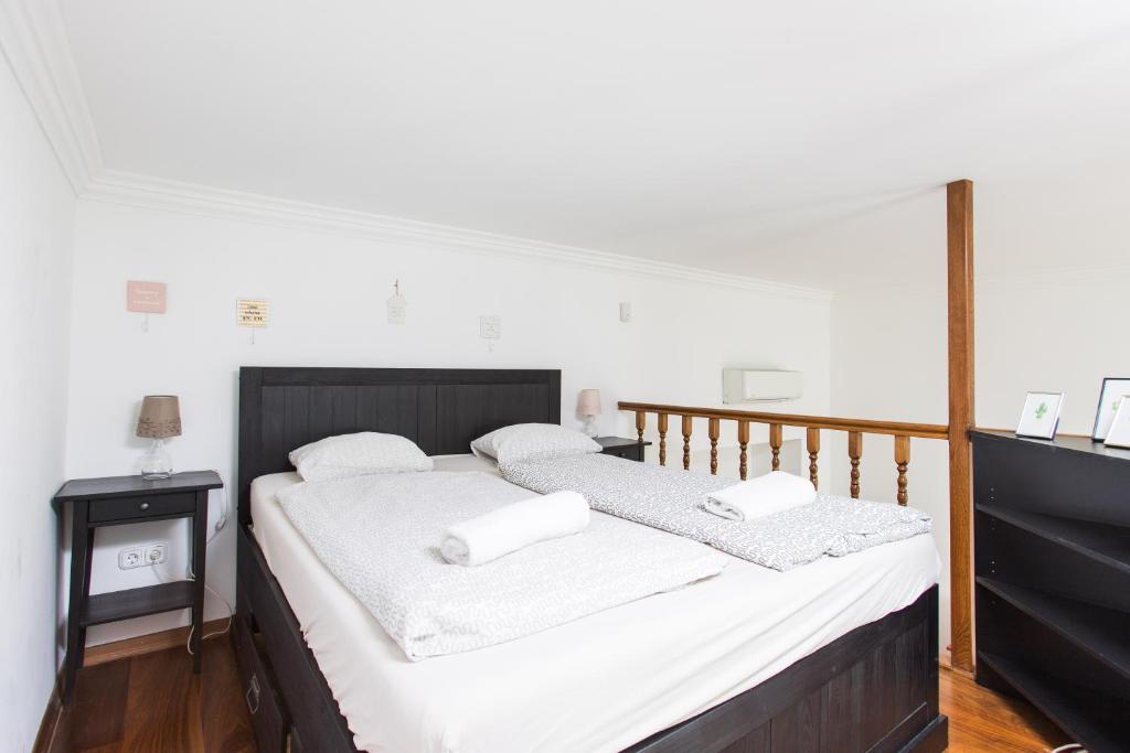 Posteľ alebo postele v izbe v ubytovaní Grand Boulvard Apartment