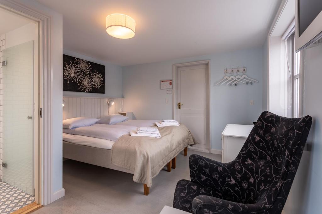 Voodi või voodid majutusasutuse Rødvig Kro og Badehotel toas