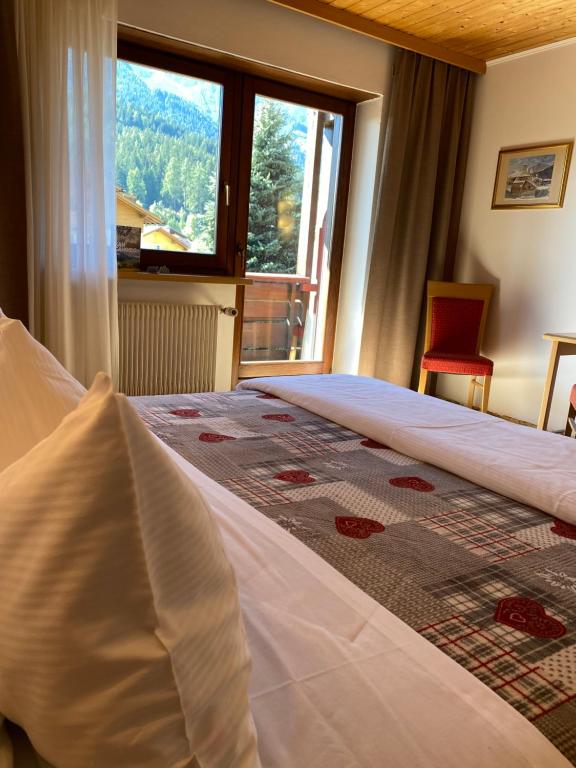Postel nebo postele na pokoji v ubytování Hotel Garni LIVING