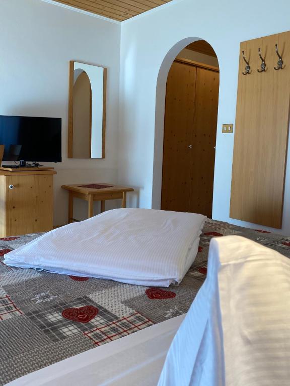 Postel nebo postele na pokoji v ubytování Hotel Garni LIVING