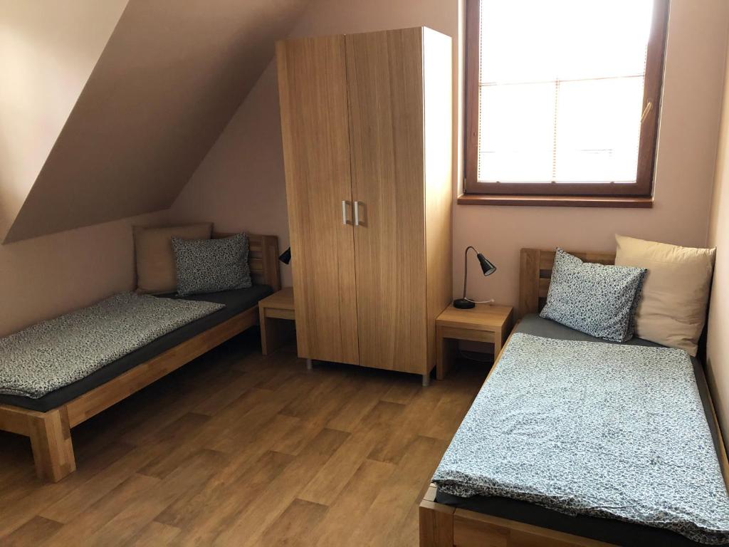Postel nebo postele na pokoji v ubytování Penzion Florian